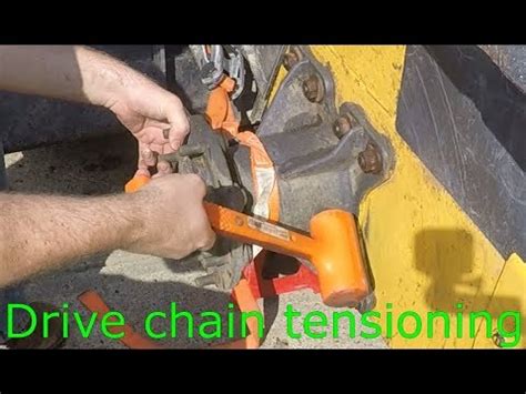 new holland skid steer chain adjustment|new holland ls170 chain tensioning.